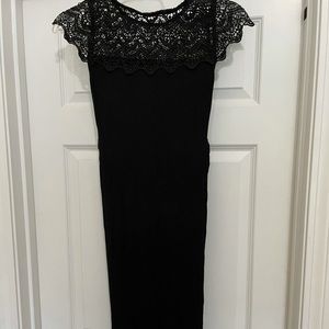Fitted black knee length maternity dress